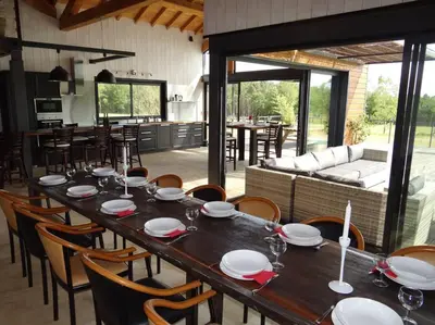 a dining room with a long table and chairs at Villa contemporaine à la campagne - Promo rentrée in Saint-Papoul