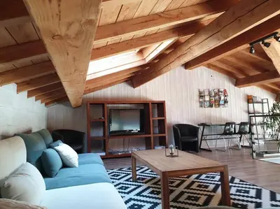 a living room with a blue couch and a tv at Villa contemporaine à la campagne - Promo rentrée in Saint-Papoul