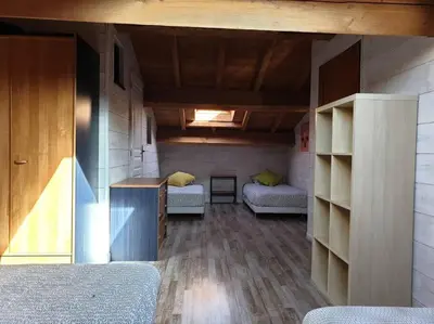 a room with two beds and a room with shelves at Villa contemporaine à la campagne - Promo rentrée in Saint-Papoul