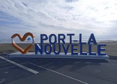 a sign that reads portilla novolele in a parking lot at MOBILHOME OLIVIER - Camping avec piscine à Port-la-Nouvelle in Port-la-Nouvelle