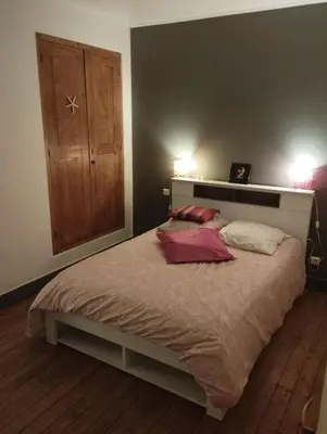 a bedroom with a bed with two pillows on it at L Aparté en Corbières in Ferrals-lès-Corbières