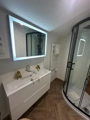 a bathroom with a white sink and a mirror at Studio familial a Mezzanine presbytère dans l'Église in Narbonne