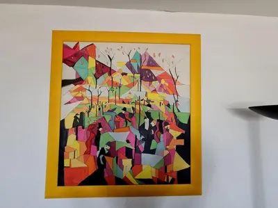 a picture of a colorful painting on a wall at Logis des Palmiers YourHostHelper in Gruissan