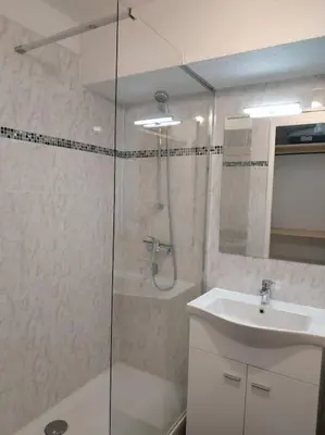 a bathroom with a shower and a sink at Studio L'air marin in Gruissan