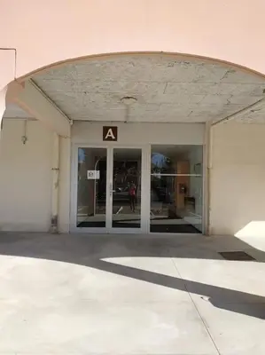 an entrance to a building with an a sign on it at Studio L'air marin in Gruissan