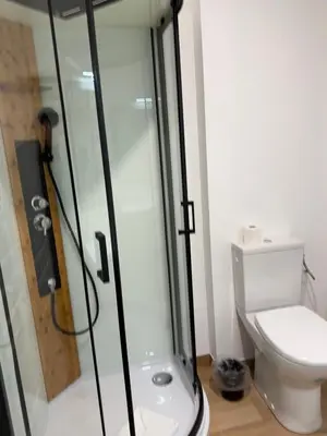 a bathroom with a shower and a toilet at Studio dans L'Eglise du Couvent in Narbonne