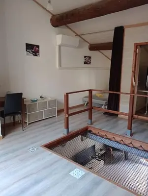 a room with a cage in the middle of a room at Le Temps Suspendu - Maison atypique avec terrasse in Fitou