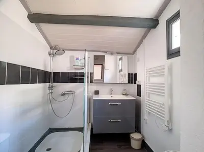 a bathroom with a shower and a sink at Le Temps Suspendu - Maison atypique avec terrasse in Fitou