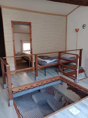a room with two bunk beds and a mirror at Le Temps Suspendu - Maison atypique avec terrasse in Fitou