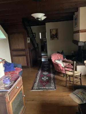 a living room with a couch and a table at Gîte col de la lauze avec vue sur le château de Montségur in Montferrier