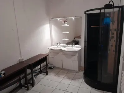 a bathroom with a shower and a sink and a toilet at hOMe-Shanti Galamus -- Relais Rando - vélo - moto in Saint-Paul-de-Fenouillet