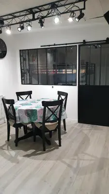 a table and two chairs in a room at BACKSTAGE STUDIO in Maury