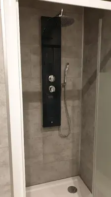 a shower with a shower head in a bathroom at BACKSTAGE STUDIO in Maury