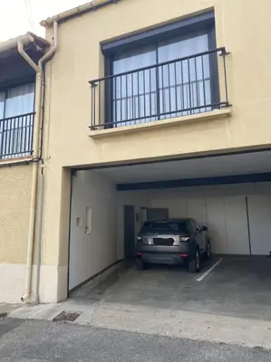 a car is parked inside of a garage at Appartement spacieux, climatisé, parking privé, wifi et vue imprenable in Cases-de-Pène