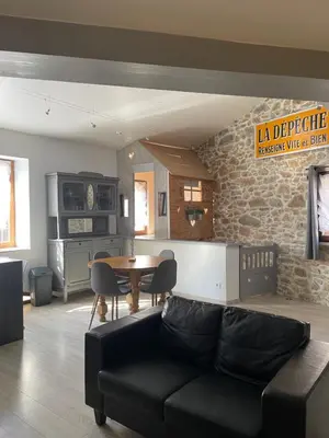 a living room with a couch and a table at Chez Tony et Laurie in Montbrun-des-Corbières