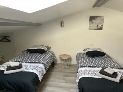 two beds sitting next to each other in a room at Chez Tony et Laurie in Montbrun-des-Corbières