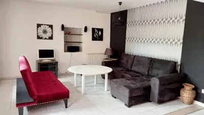 a living room with a couch and a table at Domaine Castel Negre Alet Les Bains in Alet-les-Bains