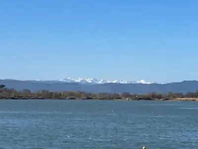 a large body of water with mountains in the background at Chalet 3 chambres, piscine, lac à 100m - Olonzac - FR-1-783-1 in Olonzac