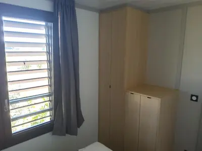 a small room with a window and a cabinet at Chalet 3 chambres, piscine, lac à 100m - Olonzac - FR-1-783-1 in Olonzac