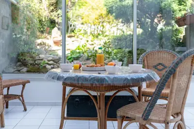 a table with a bowl of fruit on a patio at la Voûte in Carcassonne