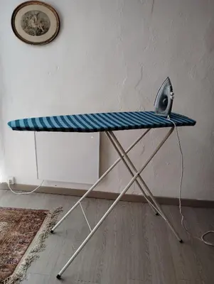 a surfboard on top of a stand in a room at Cozy self contained modern home near Carcassonne in Badens