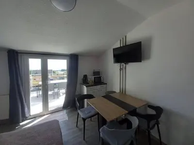 a room with a table and chairs and a window at Gîte avec piscine - 4 personnes - Pays Cathare in Cuxac-Cabardès