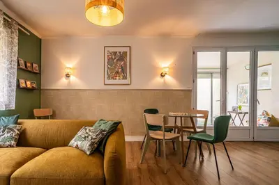 a living room with a couch and a table at Oasis Urbaine Narbonne in Narbonne