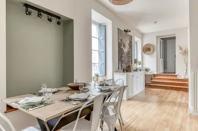 a kitchen and dining room with a table and chairs at Le Coste - Free parking - Central - Wifi -netflix in Carcassonne