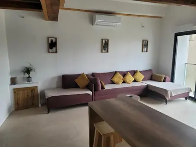 a living room with a couch and a table at BEAU T3 AU COEUR DU CENTRE VILLE (205) in Narbonne