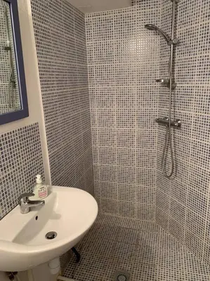 a bathroom with a sink and a shower at Townhouse in Southern France with a wonderful view and close to a Swimming pool in Axat