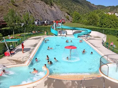 a group of people in a swimming pool at Townhouse in Southern France with a wonderful view and close to a Swimming pool in Axat