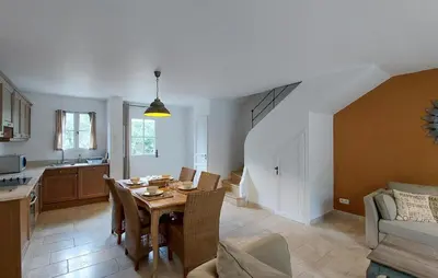 a kitchen and a dining room with a table in a room at Cozy Home In Saint-Laurent-De-La-Ca With Wifi in Saint-Laurent-de-la-Cabrerisse