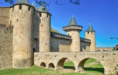 an old castle with two towers and a bridge at Lovely Home In Stlaurent-De-La-Cabr in Saint-Laurent-de-la-Cabrerisse