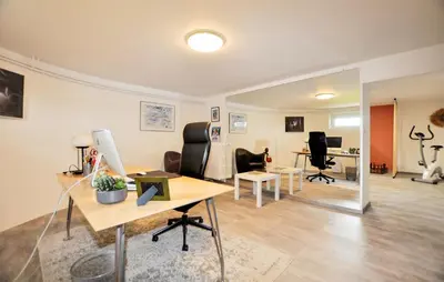 a living room with a table and a desk at 2 Bedroom Cozy Home In Tabre in Tabre