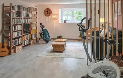 a room with a gym with an exercise bike in it at 2 Bedroom Cozy Home In Tabre in Tabre