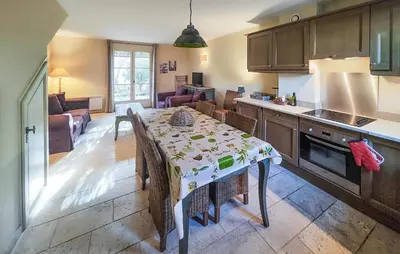 a kitchen with a table with a table cloth on it at Pet Friendly Home In Saint-Laurent-De-La-Ca in Saint-Laurent-de-la-Cabrerisse