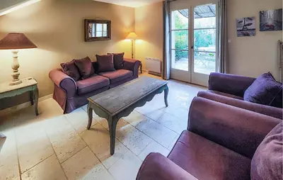 a living room with couches and a coffee table at Pet Friendly Home In Saint-Laurent-De-La-Ca in Saint-Laurent-de-la-Cabrerisse