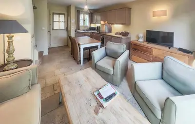 a living room with a couch and a table at Nice Home In Saint-Laurent-De-La-Ca in Saint-Laurent-de-la-Cabrerisse