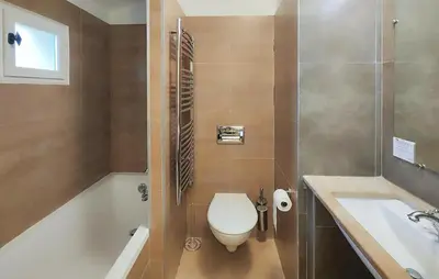 a bathroom with a toilet and a tub and a sink at Nice Home In Stlaurent-De-La-Cabr With Wifi in Saint-Laurent-de-la-Cabrerisse