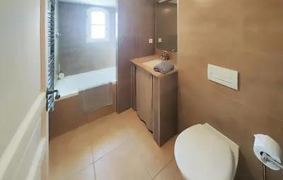 a bathroom with a toilet and a sink at 2 Bedroom Lovely Home In St-Laurent-De-La-Carbr in Saint-Laurent-de-la-Cabrerisse