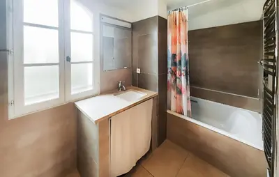 a bathroom with a sink and a bath tub at 1 Bedroom Awesome Home In Saint-Laurent-De-La-Ca in Saint-Laurent-de-la-Cabrerisse