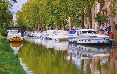 a group of boats are docked in a canal at 1 Bedroom Awesome Home In Saint-Laurent-De-La-Ca in Saint-Laurent-de-la-Cabrerisse
