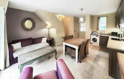 a living room with a couch and a table at 1 Bedroom Awesome Home In Saint-Laurent-De-La-Ca in Saint-Laurent-de-la-Cabrerisse