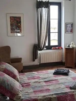a living room with a couch and a window at Chez Estelle Le SOL in Tourouzelle
