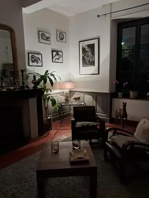 a living room with a couch and a table at Chez Estelle Le SOL in Tourouzelle