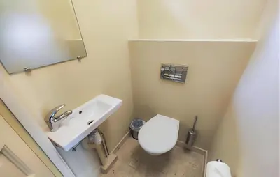 a bathroom with a white toilet and a sink at Awesome Home In Saint-Laurent-De-La-Ca With Wifi in Saint-Laurent-de-la-Cabrerisse