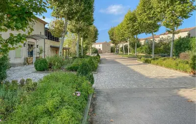 a cobblestone street in front of a house at Awesome Home In Saint-Laurent-De-La-Ca With Wifi in Saint-Laurent-de-la-Cabrerisse