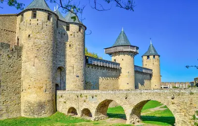 an old castle with two towers and a bridge at 2 Bedroom Awesome Home In Saint-Laurent-De-La-Ca in Saint-Laurent-de-la-Cabrerisse