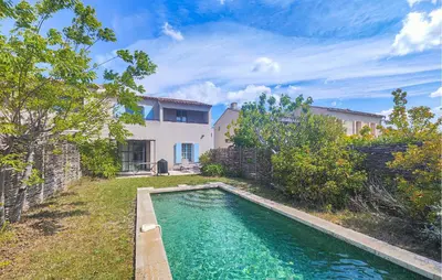 a swimming pool in the yard of a house at Amazing Home In Saint-Laurent-De-La-Ca in Saint-Laurent-de-la-Cabrerisse