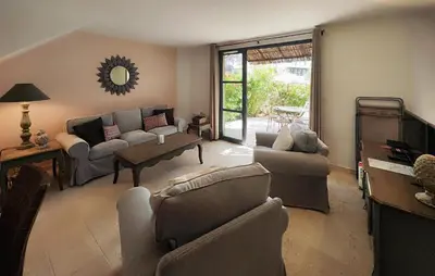 a living room with two couches and a tv at 2 Bedroom Awesome Home In Saint-Laurent-De-La-Ca in Saint-Laurent-de-la-Cabrerisse